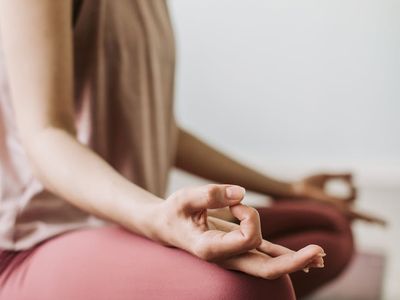 Close-up of hands in a specific yoga mudra.